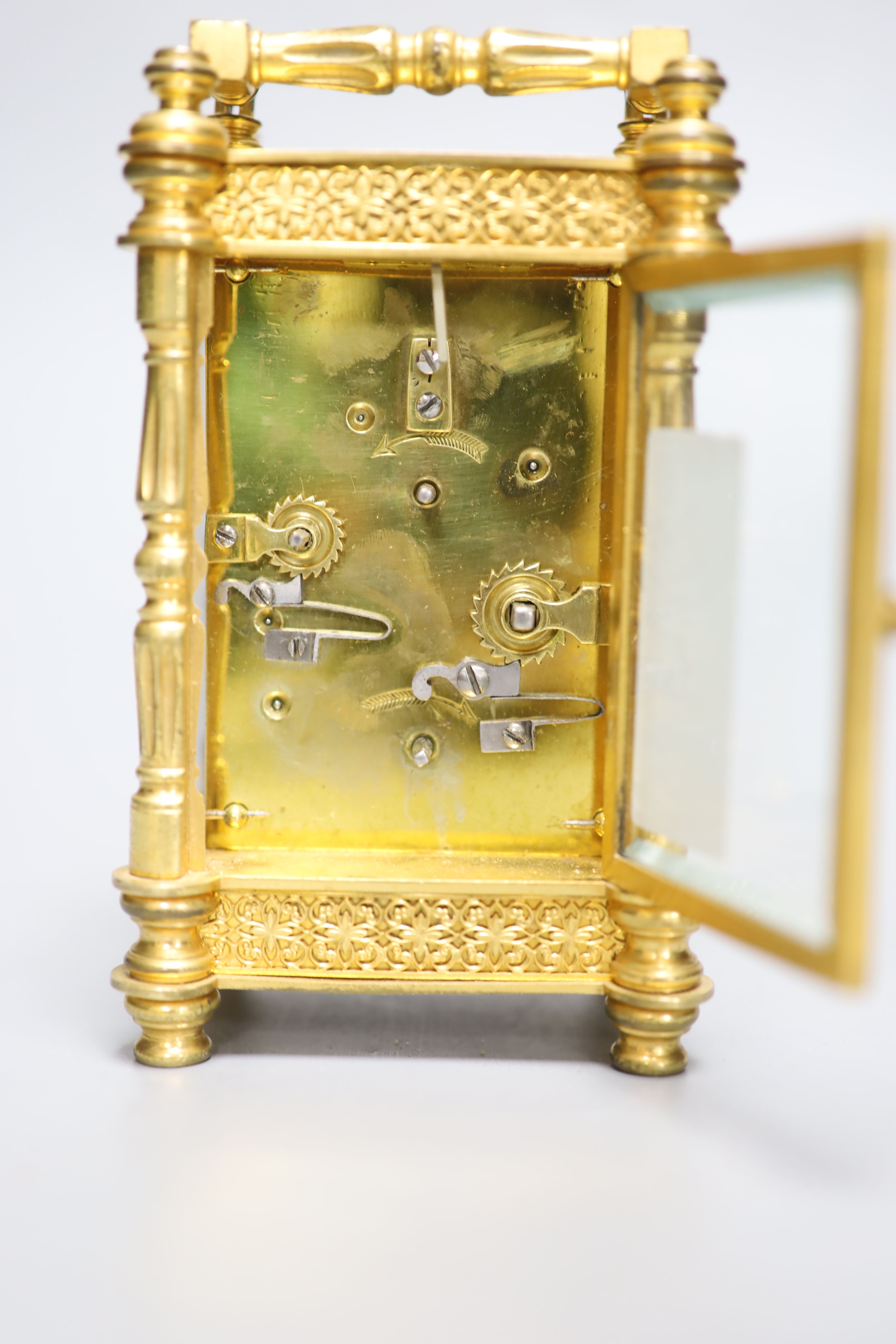 An early 20th century French brass carriage clock, with alarm, height 13.5cm with handle down